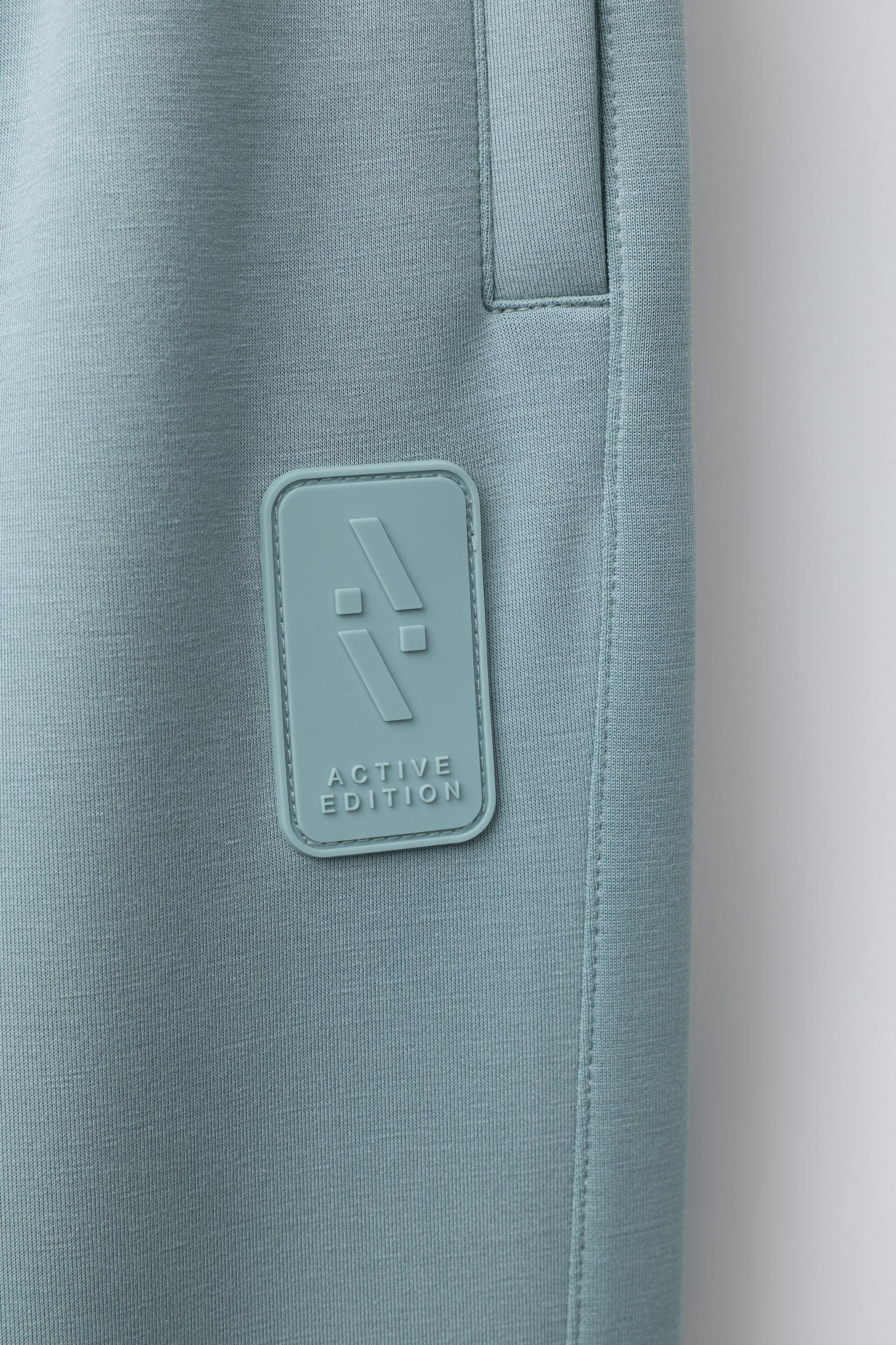 SPORTY JOGGER PANTS WITH RUBBERIZED LABEL